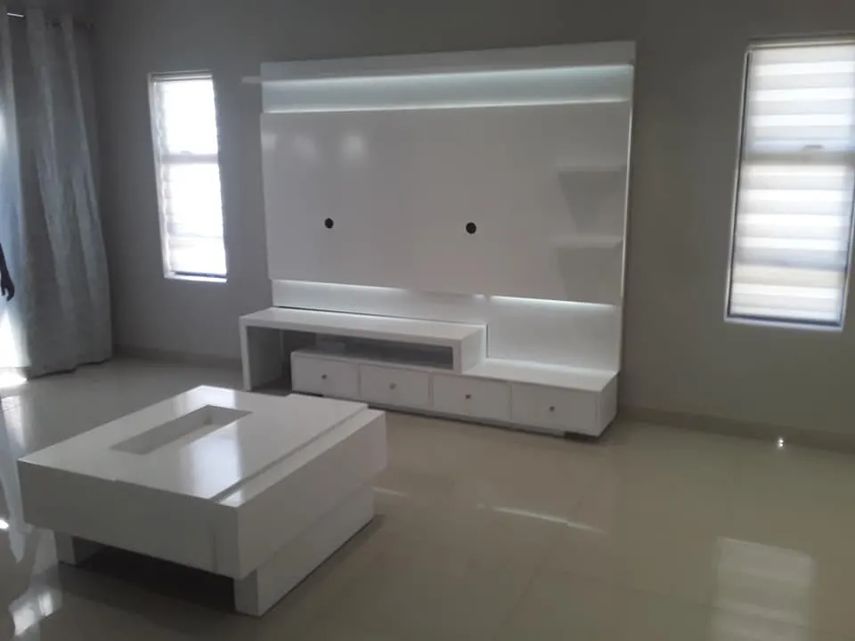 White wall-mounted TV unit, photo 1